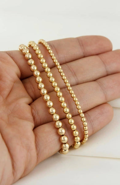 Gold Beads Bracelets- 14K Gold Steel Bead Stretch Bracelets: Yellow Gold / 6mm