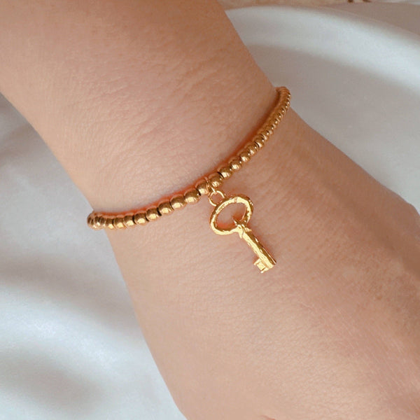 Golden Ball Single Charm Stretch Bracelet: Lucky Clover