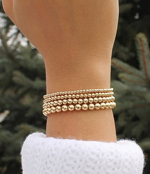 Gold Beads Bracelets- 14K Gold Steel Bead Stretch Bracelets: Yellow Gold / 6mm
