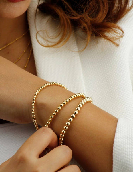 Gold Beads Bracelets- 14K Gold Steel Bead Stretch Bracelets: Yellow Gold / 6mm