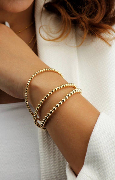 Gold Beads Bracelets- 14K Gold Steel Bead Stretch Bracelets: Yellow Gold / 6mm